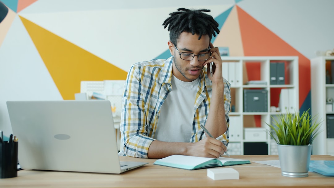 Person reviewing a debt settlement contract carefully at a desk